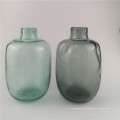 Reciclar jarrones de vidrio verde en jarrones modernos decorativos
